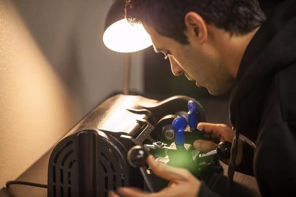 A simple photo of a locksmith at work.