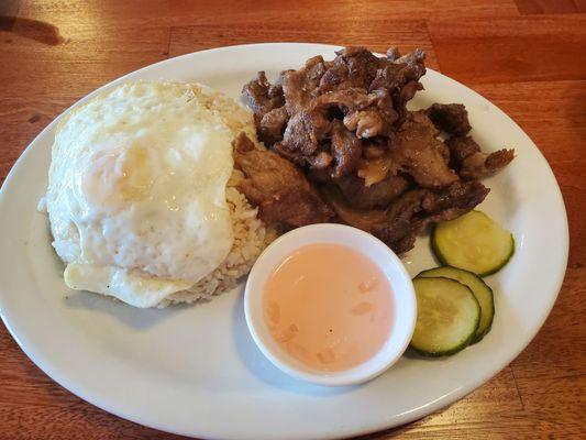 Tapsilog:  pork, garlic fried rice, fried egg, and cucumbers.   Very tender meat and tasty rice!