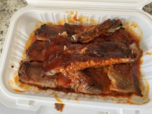 Pork Ribs Dinner. It looks like hot sauce all over it. Didn't look appetizing and didn't taste like home cooking ribs.