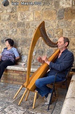 A gentleman in Italy playing the harp, which I associate with Italian food