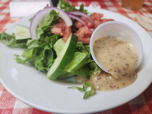 Dinner salad with Sweet Vidalia Onion poppyseed dressing.