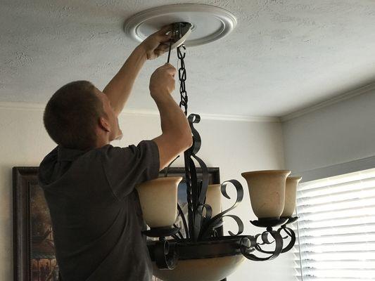 Removing a chandelier to make way for a new fixture.
Highland Park, Dallas, TX