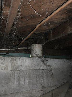 Structural support (bucket) of the underside of a house rented by Humboldt Property Management.