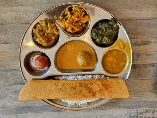 Vegetarian Thali with Masala Dosa (rice crepe with potato filling).