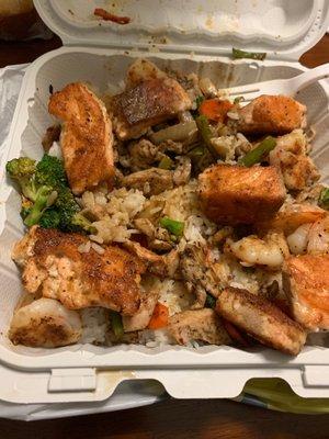 Shrimp Chicken Salmon Combo with Jasmine Rice and Teriyaki sauce.