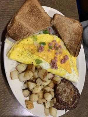 Western omelet, home fries, sausage patties, wheat toast