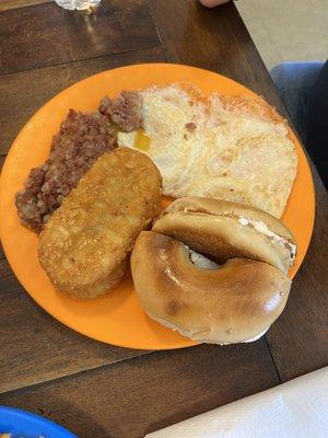 Corned beef hash with hash browns and bagel