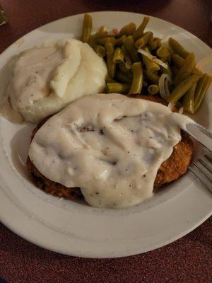 Chicken fried steak, green beans, mashed potatoes. Pretty solid food.