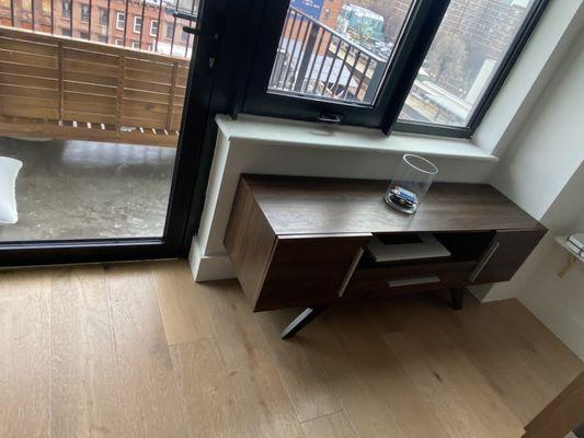 Area by second balcony in kitchen with outdoor seating and indoor server.