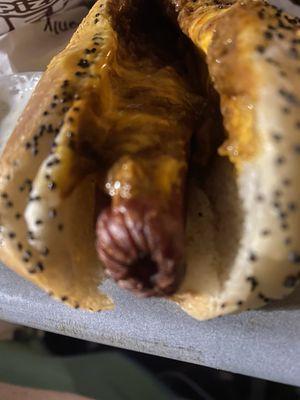 A chili cheese dog that looks old