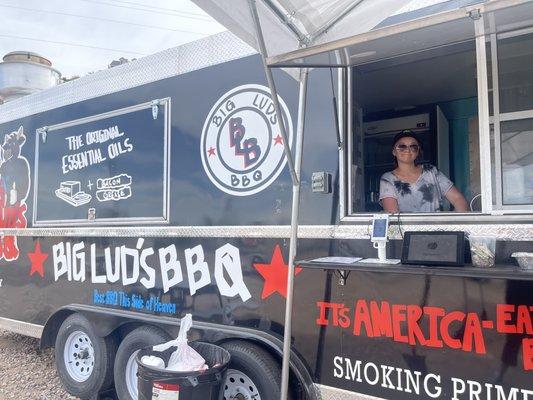 Big Lud's BBQ food truck. On Bluff Street across from Ace Hardware