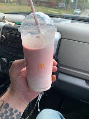 A delicious strawberry shake with whipped cream