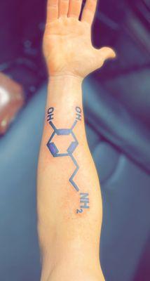 Chemical structure on underside of forearm.