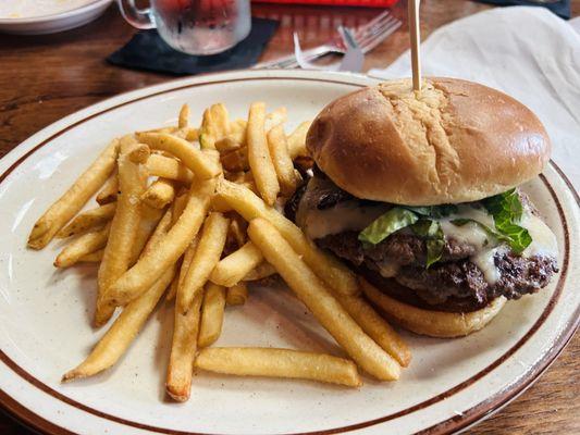 Double burger with pepper jack, bacon, bbq mayo, and onion pedals.