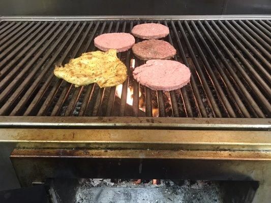 Real Wood Flamed Grilled Ground Sirloin Burgers And Succulent Chicken Breast.