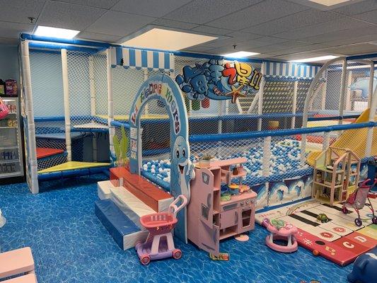 Ball pit with slide and climbing area.