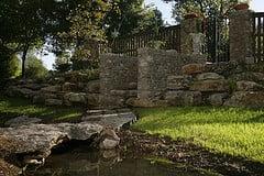 South West Stones boulders used for a special landscaping project which includes a bridge and a pond.