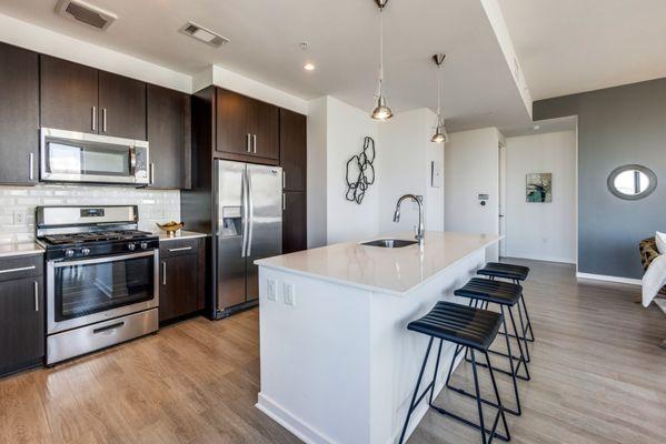 Kitchen with stainless steel appliances and kitchen island