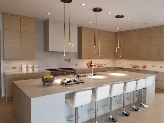 Entertainers kitchen with waterfall countertop island