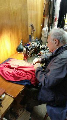 Our Tailor working on a custom order.