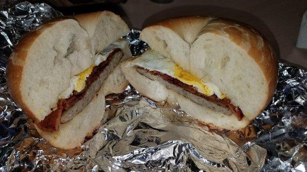 Bacon egg and sausage on a plain bagel