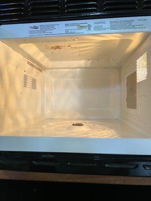 The condition of the microwave when we got the camper .