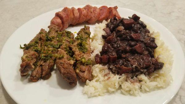 Skirt steak w/chimichurri, rice n beans cooked with chorizo and a side of chorizo (because it's so good)!  Highly recommend.