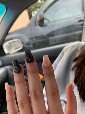 Crooked nail and you can see the black schmutz the nail tech smeared on her hand.