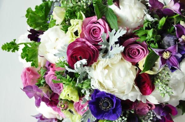 Rosa 'Cool Water'. Peony 'Gardenia', Dusty Millar, Seeded Eucalyptus, Clematis vine, Anemones, Geranium, Orchids, Ranunulas