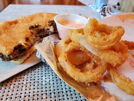 Double cheeseburger with onion rings and Big Boy sauce for both