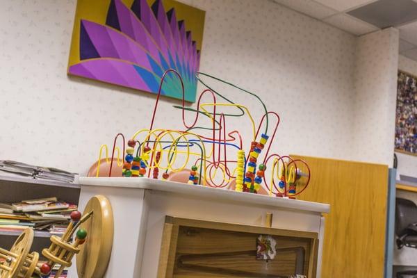 Multi-task activity center toy (on the "sick child" side of the lobby)