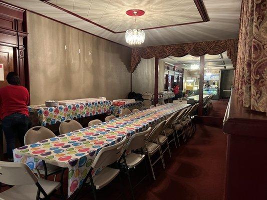 Party tables and chairs for food and cake.