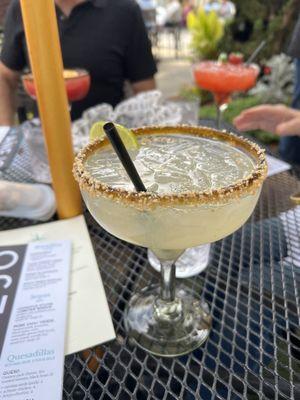 Coconut margarita rimmed with toasted coconut!