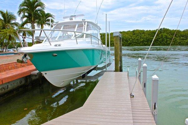 Dock with Tandeck PVC decking fastened using Camo screws. Dock and Boat Lift installed by Boat Lifts of South Florida