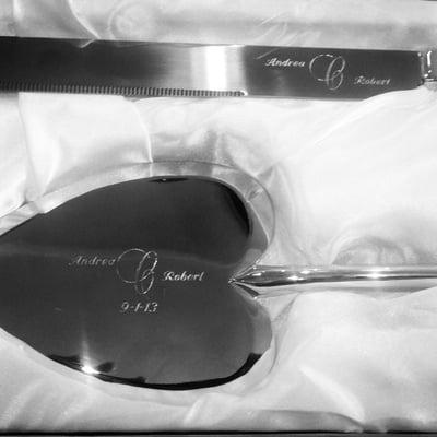 Custom logo engraved on cake cutter set.