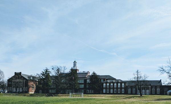 The fields and school from afar