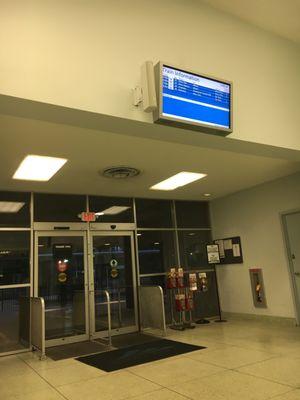 Train Information monitor and exit doors to the tracks.