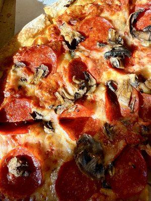 Medium Argenziano's pepperoni and mushroom pizza.