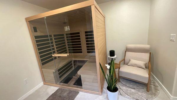 Bathroom remodel including a home sauna and relaxation area.