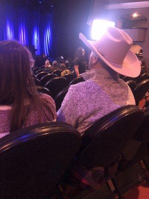 Man with cowboy hat , wouldn't take hat off ,people couldn't see , hat was so big, so owners father came over to tell him to take it off.