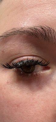 Swollen lash line from natural lashes being pulled.