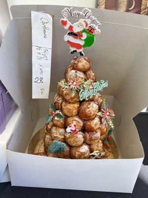 Croquembouche from Paris Bakery. Zoom in to bottom right to see broken base. It was broken before I even arrived to pick it up.