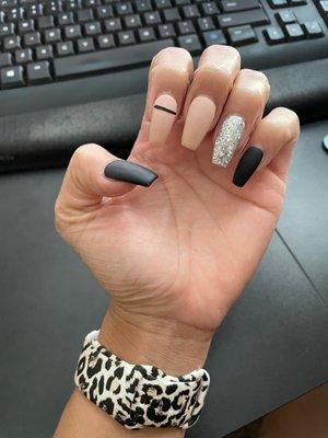 Matte acrylic nail design with glitter