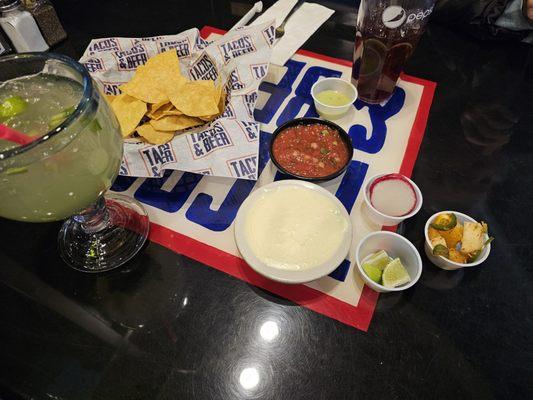 Spicy Jalapeno Margarita, warm creamy habanero sauce, radishes (wish they were pickled), spicy fruit salad, warm table chips and salsa