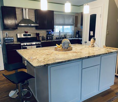 New island with granite countertop.