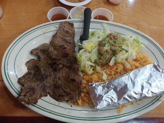 Carne asada with sauces from salsa bar