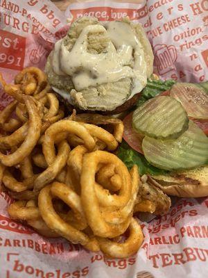 Crispy chicken sandwich with fried pickles & curly fries