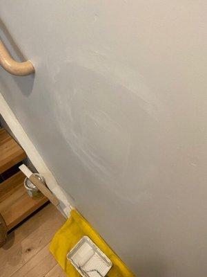 A1 damaged my wall and considers this awful repair "complete".