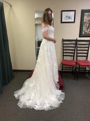 The wedding dress I had done with hem. The hem has to take lace flowers off and cut the length and put the lace flowers back on the dress.