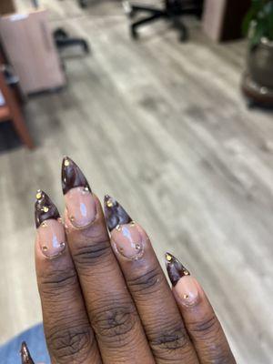 Acrylic nails in the shape of stiletto.